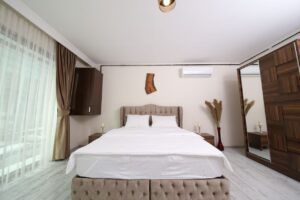 pexels-photo-3659681-3659681 Contemporary bedroom with elegant furniture and decor in an Istanbul hotel room.