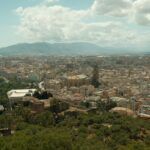 A breathtaking aerial view of Málaga, Spain, showcasing the city's historic architecture and surrounding landscape.